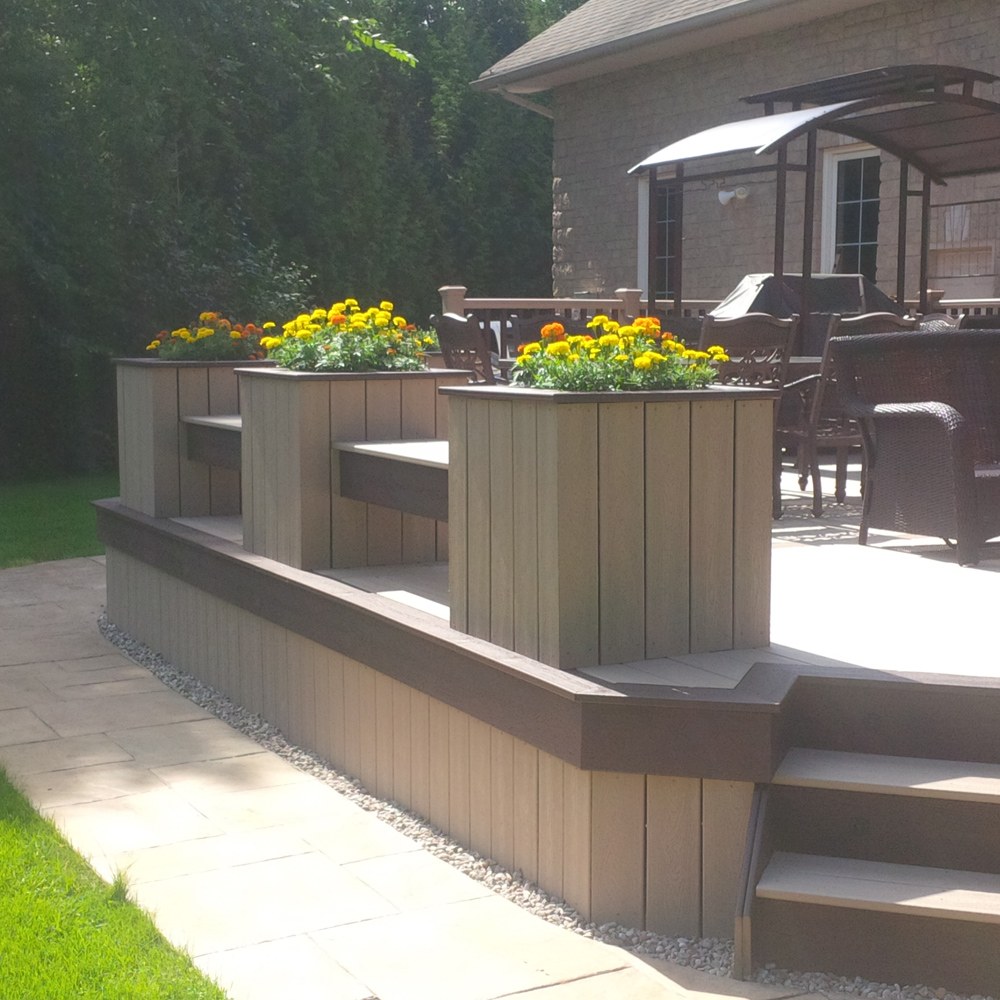 detail of low height custom deck with planters and benches around the perimeter