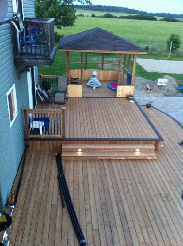 top down view of custom two level deck with pergola and lights embedded in steps