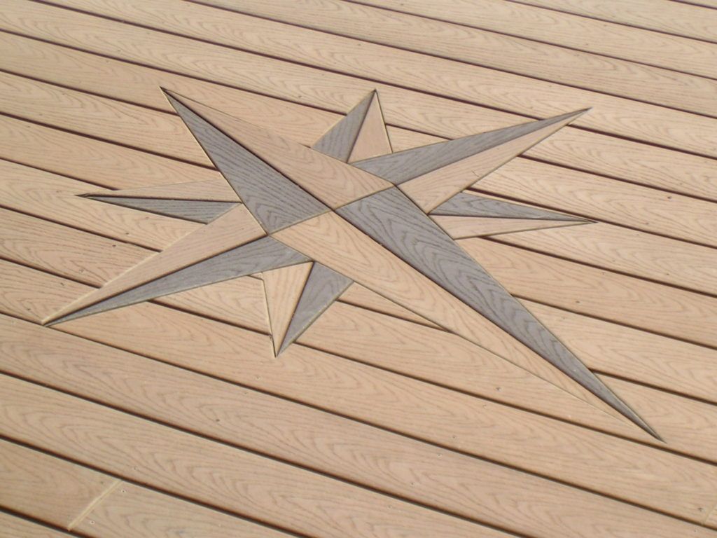 intricately embedded compass design in custom deck floor
