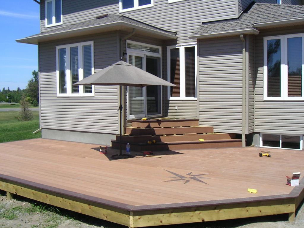 custom deck with engraved compass symbol on floor