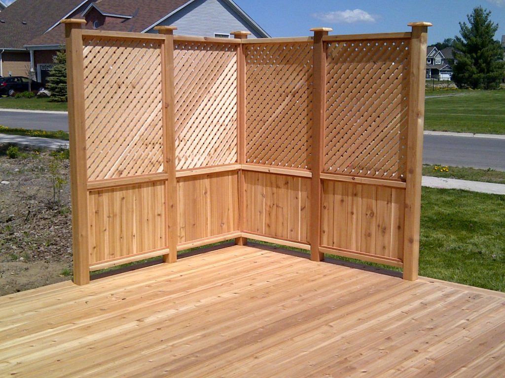 custom wooden deck with corner fence