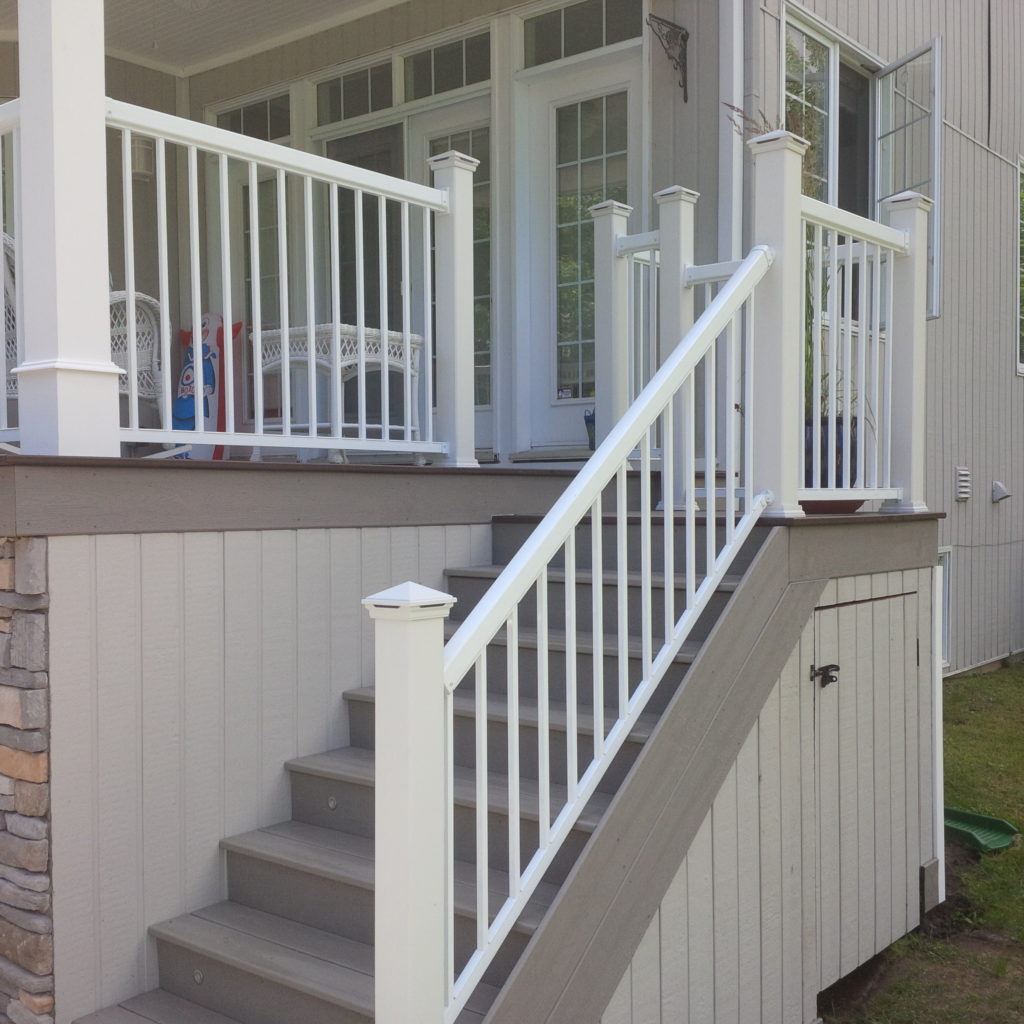 stairs with railing leading down from covered custom deck