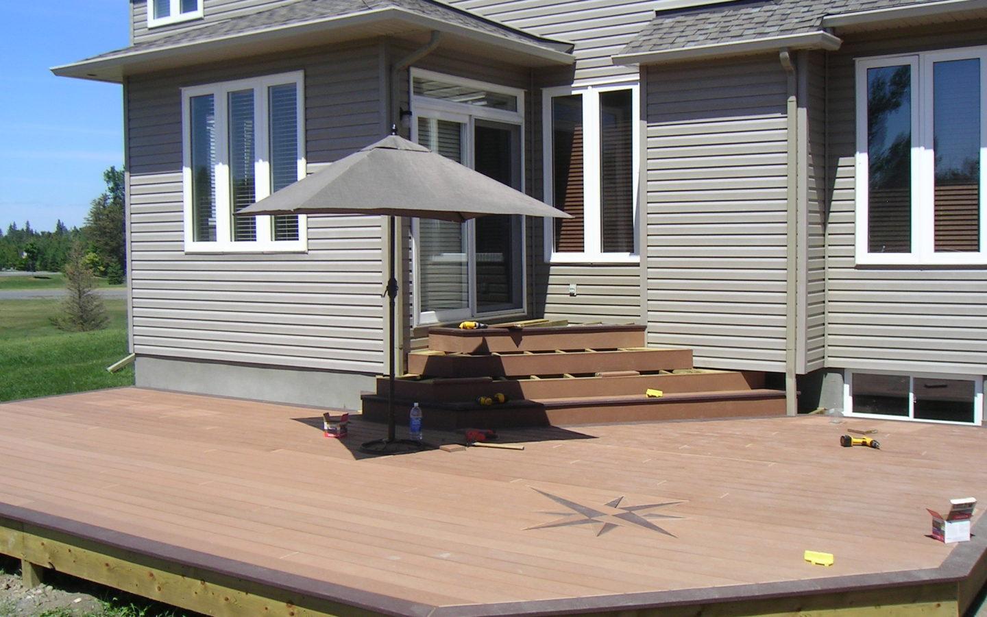 custom deck with engraved compass symbol on floor